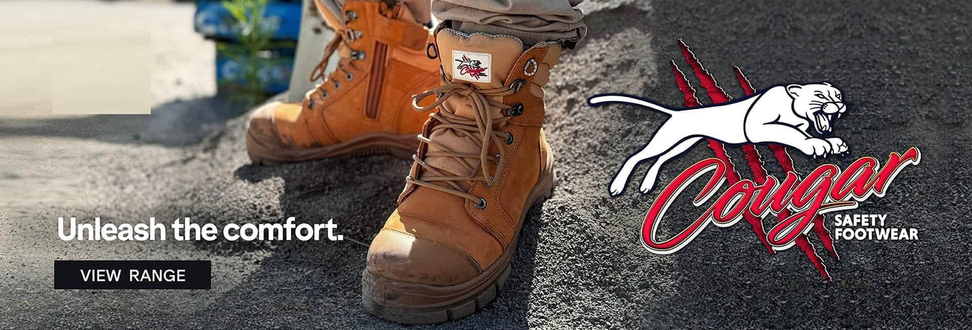 A close-up of a brown work boot with laces and a logo, sitting on rocky terrain, with the text 'Work.' and a brand logo on the right side.