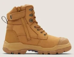 Image of a tan-colored boot with laces and a zippered side, featuring a rugged sole and a padded ankle collar.