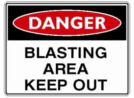 "DANGER BLASTING AREA KEEP OUT" in bold red and black lettering, warning against entry into a blasting zone.