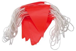 High-visibility red bunting flags on a continuous white cord for large-scale safety marking.