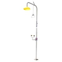 Floor-mounted emergency deluge shower and eyewash station combination, featuring a high-visibility yellow shower head and pull rod.