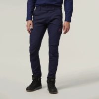 Image of a person wearing navy blue pants and a long-sleeved navy top, with hands relaxed at their sides, standing on a light background.