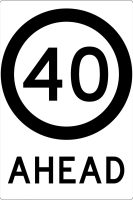 A road sign reading "40 AHEAD," which indicates a speed limit of 40 units (presumably kilometers or miles per hour) approaching ahead. The design includes a circular border around the number.